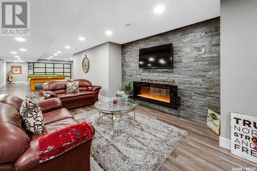 6096 Clarence Avenue S, Corman Park Rm No. 344, SK - Indoor Photo Showing Living Room With Fireplace