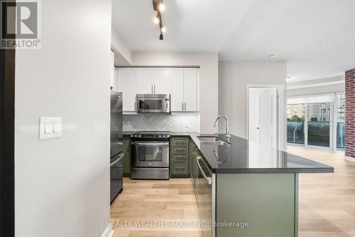 302 - 60 Absolute Avenue, Mississauga, ON - Indoor Photo Showing Kitchen With Stainless Steel Kitchen With Double Sink