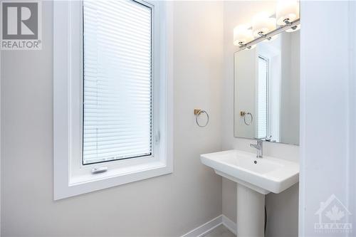 2pc powder room off the foyer - 261 Surface Lane, Ottawa, ON - Indoor Photo Showing Bathroom