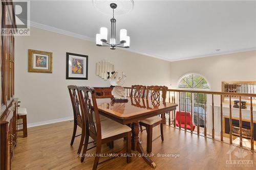 Two patio doors to full balcony - 13 Waterford Way, Ottawa, ON - Indoor Photo Showing Living Room With Fireplace