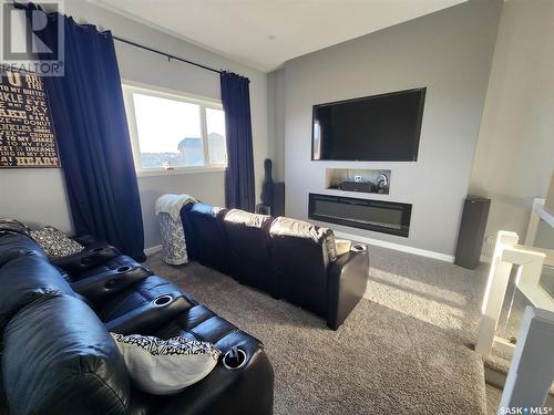 5205 Canuck Crescent, Regina, SK - Indoor Photo Showing Living Room With Fireplace