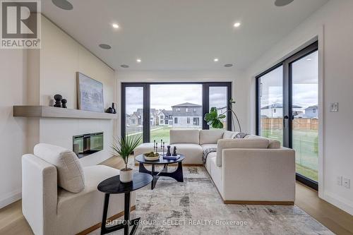 4 Kaiser Lane, Middlesex Centre (Komoka), ON - Indoor Photo Showing Living Room With Fireplace