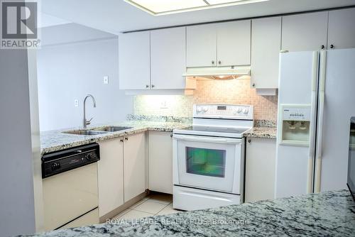 211 - 45 Kingsbridge Garden Circle, Mississauga, ON - Indoor Photo Showing Kitchen With Double Sink