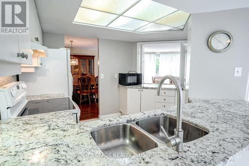 211 - 45 Kingsbridge Garden Circle, Mississauga, ON - Indoor Photo Showing Kitchen With Double Sink