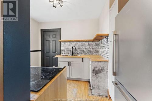 557 Moy, Windsor, ON - Indoor Photo Showing Kitchen With Double Sink