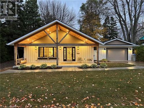 View of front of house with a porch, a front lawn, and a garage - 31 Glass Street, Bayfield, ON - Outdoor