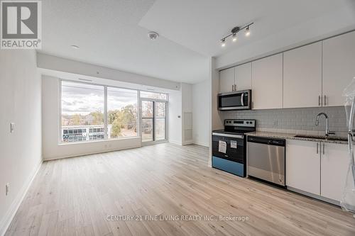 318 - 3220 Sheppard Avenue E, Toronto, ON - Indoor Photo Showing Kitchen With Stainless Steel Kitchen