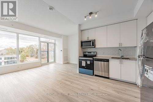 318 - 3220 Sheppard Avenue E, Toronto, ON - Indoor Photo Showing Kitchen With Stainless Steel Kitchen