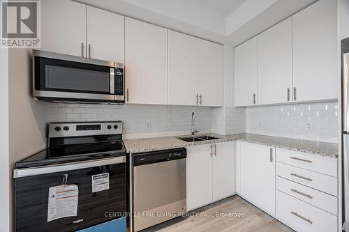 318 - 3220 Sheppard Avenue E, Toronto, ON - Indoor Photo Showing Kitchen With Stainless Steel Kitchen With Double Sink With Upgraded Kitchen