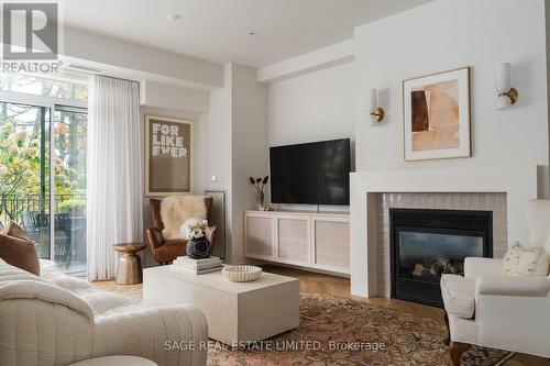 101 - 80 Palace Pier Court, Toronto, ON - Indoor Photo Showing Living Room With Fireplace