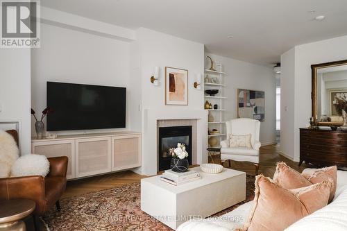 101 - 80 Palace Pier Court, Toronto, ON - Indoor Photo Showing Living Room With Fireplace