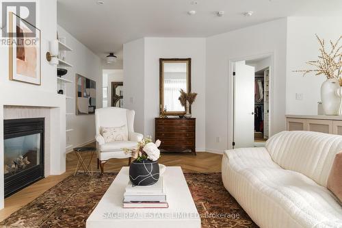 101 - 80 Palace Pier Court, Toronto, ON - Indoor Photo Showing Living Room With Fireplace