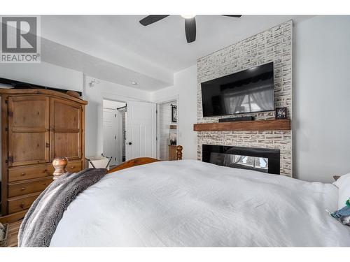 253 Royal Avenue, Kamloops, BC - Indoor Photo Showing Bedroom With Fireplace