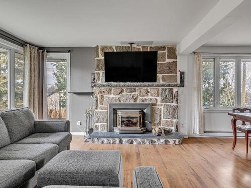 Salon - 500 Rue Des Plaines-Rouges, Québec (La Haute-Saint-Charles), QC - Indoor Photo Showing Living Room With Fireplace