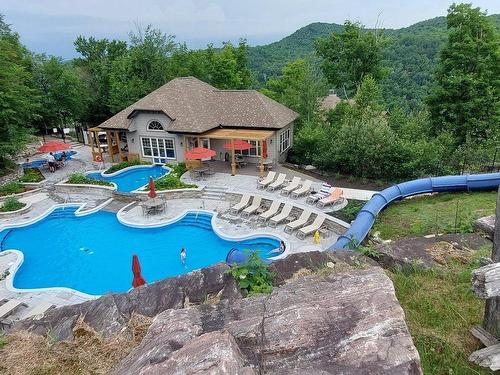 Pool - 4-280 Rue Du Mont-Plaisant, Mont-Tremblant, QC - Outdoor With In Ground Pool With Backyard