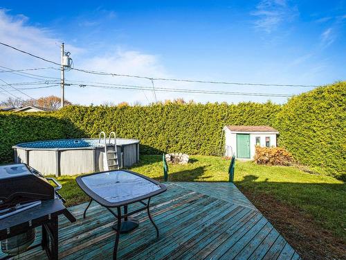 Backyard - 111 Rue Belvédère, Saint-Jean-Sur-Richelieu, QC - Outdoor With Above Ground Pool