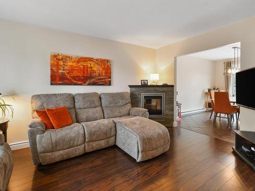 Living room - 3960 Crois. Oscar, Brossard, QC - Indoor Photo Showing Living Room With Fireplace