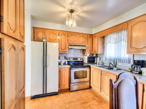 Kitchen - 309 Rue Dubé, Laval (Laval-Des-Rapides), QC - Indoor Photo Showing Kitchen With Double Sink