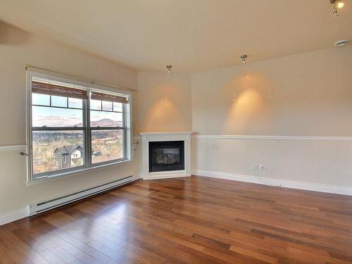 Salon - 561 Rue St-Alphonse S., Magog, QC - Indoor Photo Showing Living Room With Fireplace