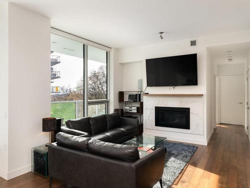 204-4011 Rainbow Hill Lane, Saanich, BC - Indoor Photo Showing Living Room With Fireplace