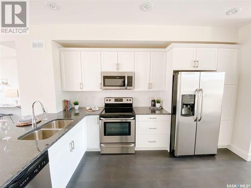 608 701 Meadows Boulevard, Saskatoon, SK - Indoor Photo Showing Kitchen With Stainless Steel Kitchen With Double Sink With Upgraded Kitchen