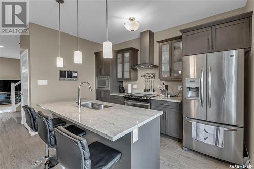 150 3229 Elgaard Drive, Regina, SK - Indoor Photo Showing Kitchen With Double Sink With Upgraded Kitchen