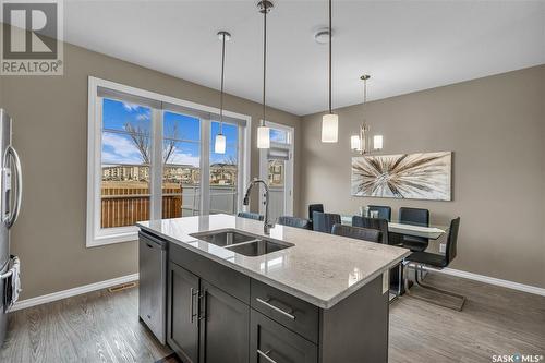 150 3229 Elgaard Drive, Regina, SK - Indoor Photo Showing Kitchen With Double Sink