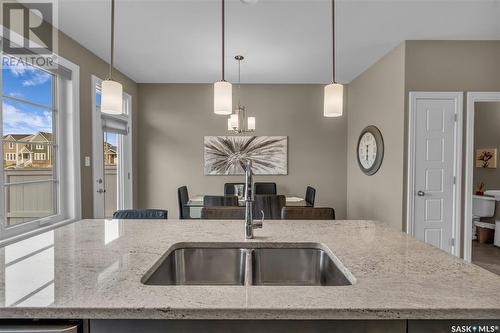 150 3229 Elgaard Drive, Regina, SK - Indoor Photo Showing Kitchen With Double Sink