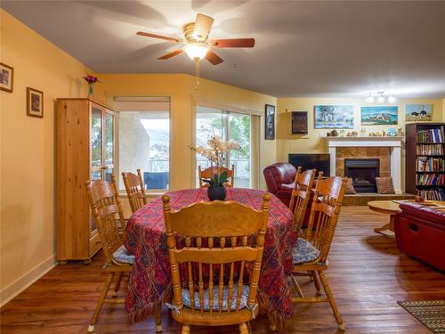 308-1750 Atkinson Street, Penticton, BC - Indoor Photo Showing Dining Room With Fireplace