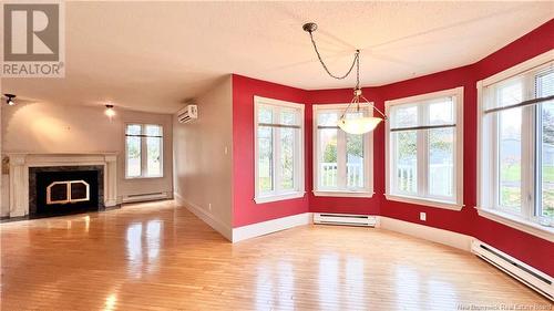 98 Rue Kent Lodge, Beresford, NB - Indoor Photo Showing Other Room With Fireplace