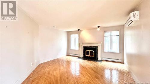 98 Rue Kent Lodge, Beresford, NB - Indoor Photo Showing Living Room With Fireplace