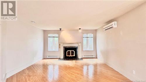 98 Rue Kent Lodge, Beresford, NB - Indoor Photo Showing Living Room With Fireplace