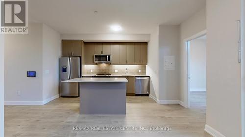 601 - 3220 William Coltson Avenue, Oakville, ON - Indoor Photo Showing Kitchen With Stainless Steel Kitchen With Upgraded Kitchen