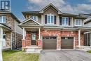 View of front of property featuring a garage and a porch - 26 Elsegood Drive, Guelph, ON  - Outdoor With Facade 