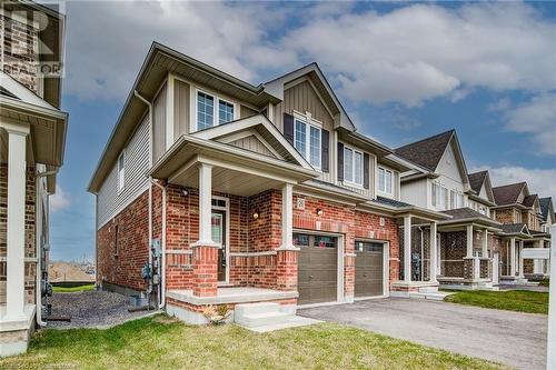 View of front of home with a garage and a front yard - 26 Elsegood Drive, Guelph, ON - Outdoor With Deck Patio Veranda With Facade