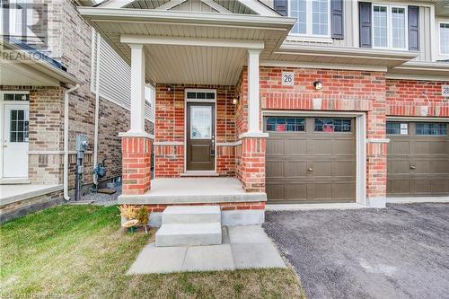 Doorway to property featuring a garage - 26 Elsegood Drive, Guelph, ON - Outdoor With Deck Patio Veranda With Facade