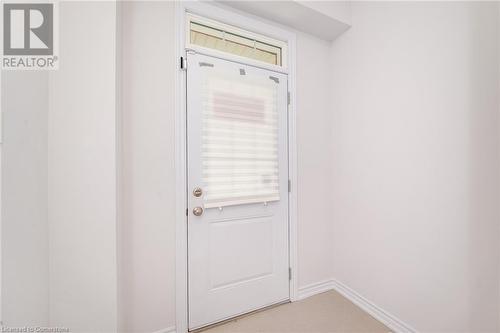 Doorway with plenty of natural light and light colored carpet - 26 Elsegood Drive, Guelph, ON - Indoor Photo Showing Other Room