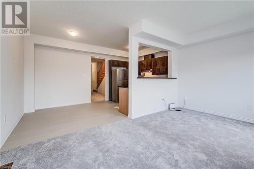 Unfurnished living room with light carpet - 26 Elsegood Drive, Guelph, ON - Indoor Photo Showing Other Room