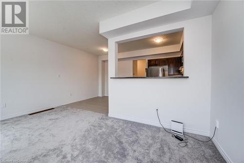 Unfurnished living room featuring light colored carpet - 26 Elsegood Drive, Guelph, ON - Indoor Photo Showing Other Room