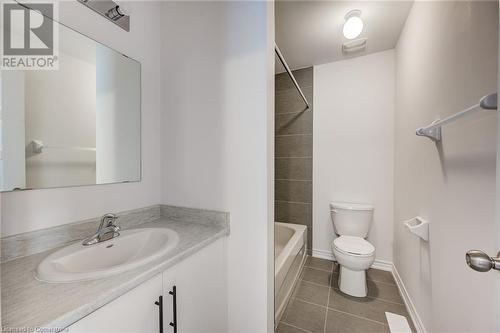 Full bathroom featuring tile patterned flooring, vanity, toilet, and tiled shower / bath - 26 Elsegood Drive, Guelph, ON - Indoor Photo Showing Bathroom