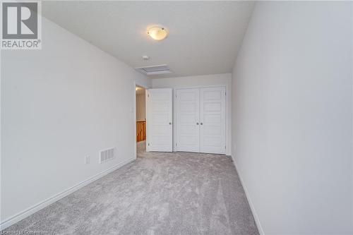 Unfurnished bedroom with light carpet and a closet - 26 Elsegood Drive, Guelph, ON - Indoor Photo Showing Other Room