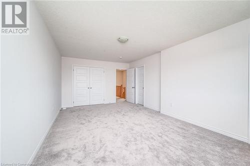 Unfurnished bedroom featuring a closet and carpet - 26 Elsegood Drive, Guelph, ON - Indoor Photo Showing Other Room