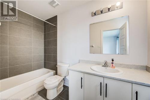 Full bathroom featuring tile patterned flooring, vanity, tiled shower / bath combo, and toilet - 26 Elsegood Drive, Guelph, ON - Indoor Photo Showing Bathroom