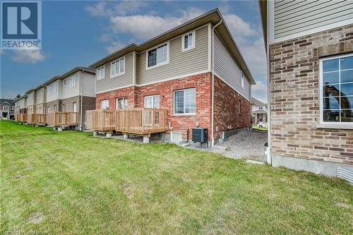 Back of house featuring central AC unit, a wooden deck, and a yard - 26 Elsegood Drive, Guelph, ON - Outdoor With Deck Patio Veranda