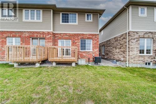 Rear view of house with central AC unit, a lawn, and a deck - 26 Elsegood Drive, Guelph, ON - Outdoor With Deck Patio Veranda