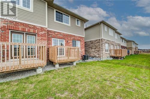 Back of house with central air condition unit, a yard, and a deck - 26 Elsegood Drive, Guelph, ON - Outdoor With Deck Patio Veranda With Exterior