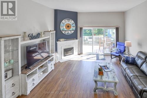 Unit #6 - 4 Paradise Boulevard W, Ramara, ON - Indoor Photo Showing Living Room With Fireplace