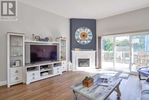 Unit #6 - 4 Paradise Boulevard W, Ramara, ON - Indoor Photo Showing Living Room With Fireplace