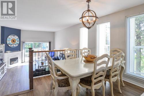 Unit #6 - 4 Paradise Boulevard W, Ramara, ON - Indoor Photo Showing Dining Room With Fireplace