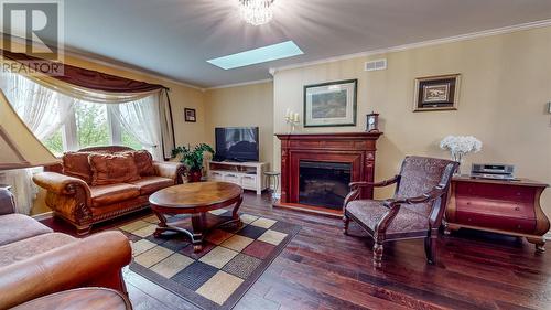 10 Robin'S Pond Hill Road, Torbay, NL - Indoor Photo Showing Living Room With Fireplace